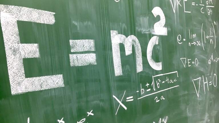 A chalkboard with mathematical equations