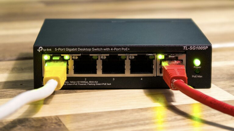 A network switch with ethernet cables connected